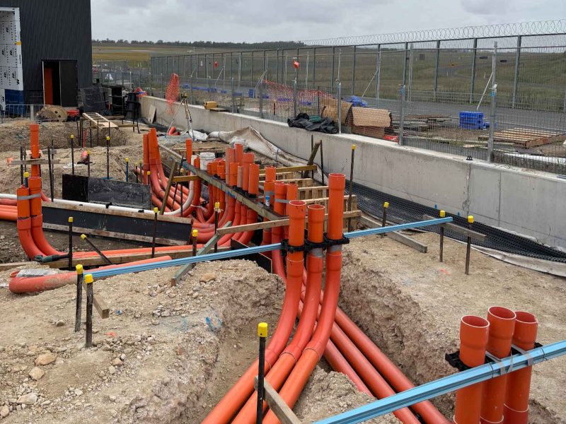 Communications and electrical conduit stub-ups installed as ingrounds